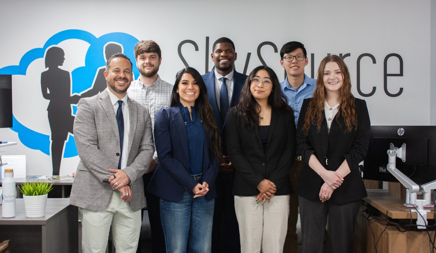 Group of professionals in office setting.