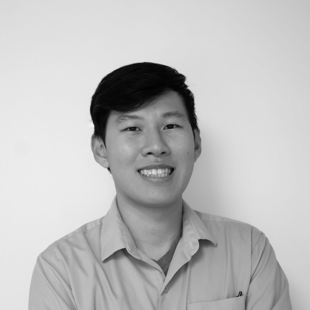 Smiling person in a black and white portrait.